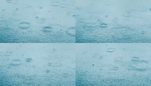 抽象的背景，雨滴落在水面上高清在线视频素材下载