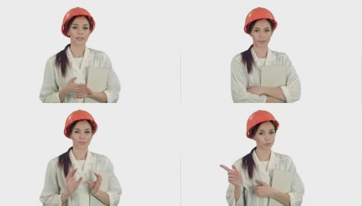 戴安全帽的女建筑师拿着平板电脑对着白色背景的相机说话高清在线视频素材下载