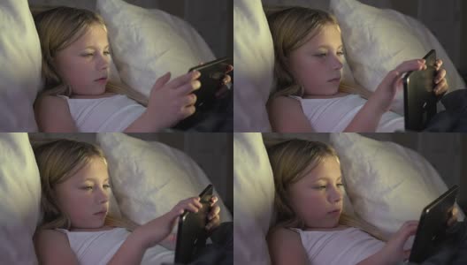 女性儿童使用科技上床睡觉高清在线视频素材下载