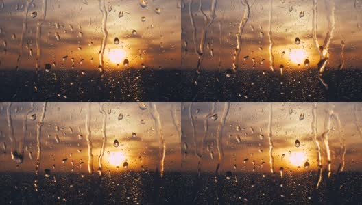 美丽的日出，同时下雨。在窗户后面看日出。4 k高清在线视频素材下载