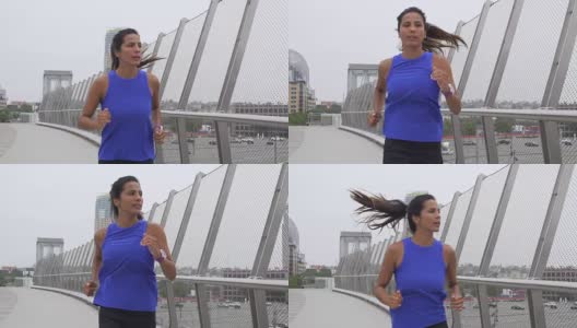 慢动作年轻的混合种族妇女在市中心城市设置跑步高清在线视频素材下载