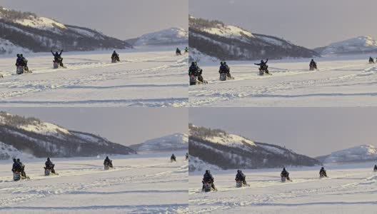 SLO MO游客享受乘坐雪地摩托的乐趣高清在线视频素材下载