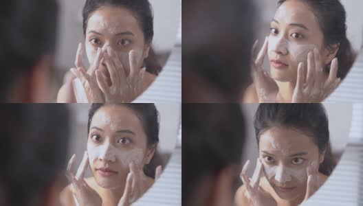 美丽的亚洲女性用水洗脸洗脸。高清在线视频素材下载