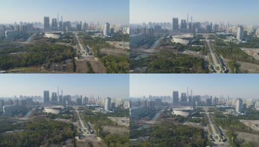 在阳光明媚的一天，绿色公园和上海市中心。中国鸟瞰图。无人机是向前和向上飞行。远景。高清在线视频素材下载