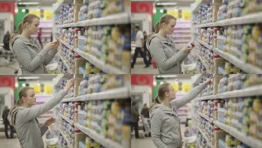 年轻女子正在超市挑选食物。高清在线视频素材下载