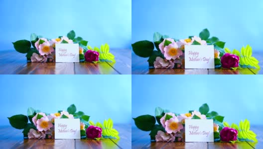 美丽盛开的玫瑰和一张送给母亲的贺卡高清在线视频素材下载
