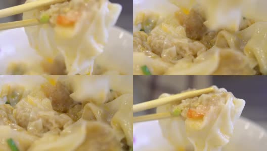 慢动作的人用棒子吃亚洲餐厅的虾饺高清在线视频素材下载
