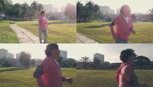 一位华裔老年妇女在公园晨练，在人行道上跑步高清在线视频素材下载