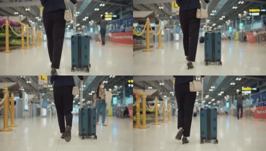 迷人的商务女性走向机场的值机柜台高清在线视频素材下载