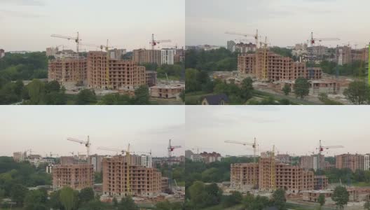 建筑工地鸟瞰图与建筑起重机和高层公寓在一个城市。高清在线视频素材下载