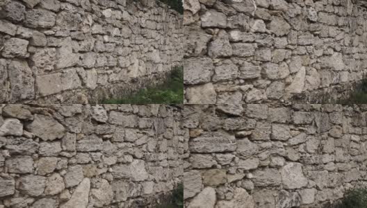 石墙的纹理。古堡石墙纹理背景。石墙作为背景或纹理。相机移动。高清在线视频素材下载