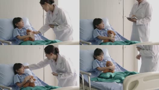 亚洲医生护士儿科医生妇女探望儿童女孩病人和移情到诊断看病时。医疗保健理念、健康家庭、儿科体检和医院办公室。高清在线视频素材下载