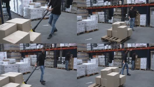 男工人在仓库用手推车搬运箱子高清在线视频素材下载