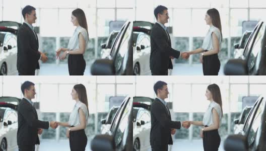 达成协议后，年轻的商人与女商人握手高清在线视频素材下载