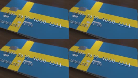 带有瑞典国旗的塑料银行卡。国家银行系统相关动画高清在线视频素材下载