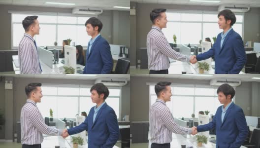 在办公室里，一位亚洲商人在握手。谈判完成后，合作协议就成功了。高清在线视频素材下载