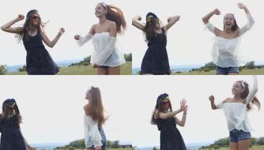 两个年轻女子在草地上跳舞，慢镜头高清在线视频素材下载
