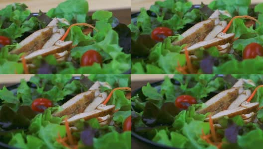烤鸡配番茄和蔬菜沙拉。高清在线视频素材下载