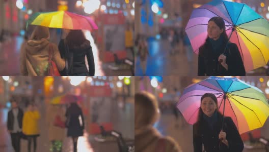 两个女性朋友在一个下雨的晚上相遇高清在线视频素材下载
