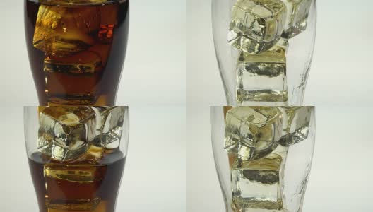 苏打水装在玻璃杯里，冰通过管子喝。白色背景。Ckose起来高清在线视频素材下载