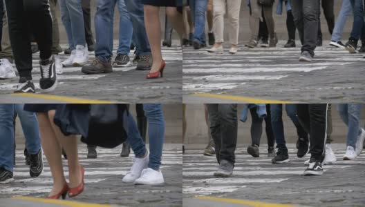 在人行横道上慢动作行走的人群的脚高清在线视频素材下载