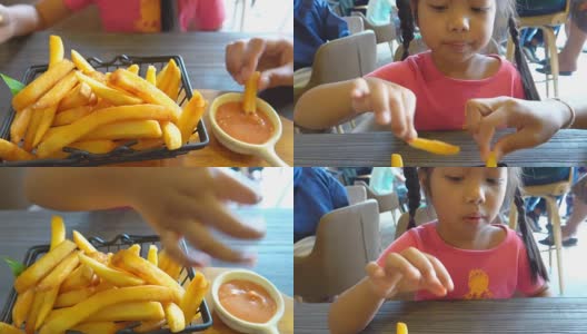 小女孩在吃薯条高清在线视频素材下载