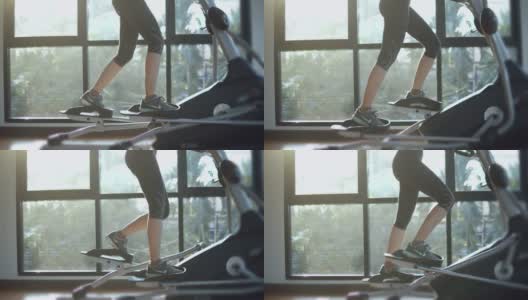 在有氧运动机上锻炼的女人高清在线视频素材下载