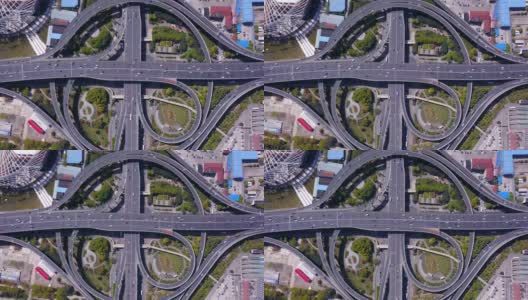 带环岛的公路交汇处鸟瞰图。桥梁道路在建筑结构和交通理念上呈环形。前视图。城市城市，中国上海。高清在线视频素材下载