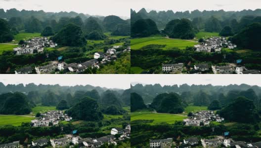 喀斯特山峰森林(万峰林)的村庄和稻田，贵州，中国。高清在线视频素材下载