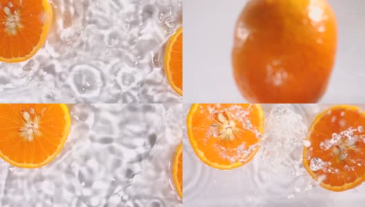 超级慢动作:橙子片落在水面上溅起水花高清在线视频素材下载