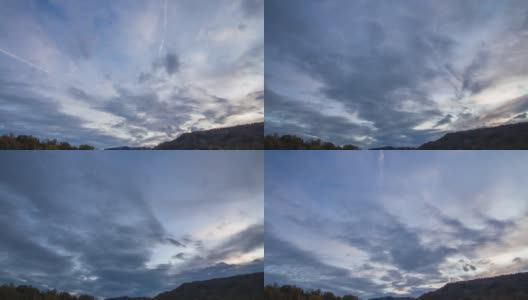 间隔拍摄云。夕阳在山。云朵飘过群山。高清在线视频素材下载