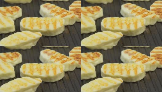 哈罗米奶酪熔点高，因此可以油炸或烧烤。高清在线视频素材下载