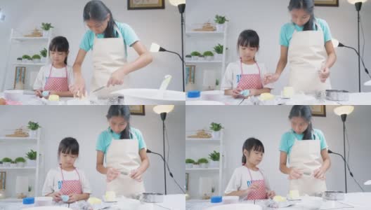 亚洲孩子在家里一起烤饼干前测量黄油，生活方式的概念。高清在线视频素材下载