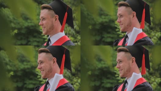 笑容满面的男毕业生拿着文凭，摆姿势拍照，拍照高清在线视频素材下载