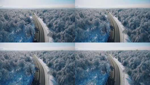 汽车在白雪覆盖的森林中行驶高清在线视频素材下载