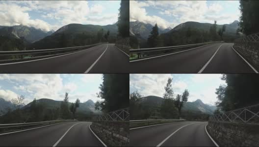 骑摩托车的人在欧洲美丽的风景山路上。第一个人的观点高清在线视频素材下载
