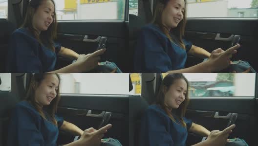 女人在开车旅行时使用手机高清在线视频素材下载