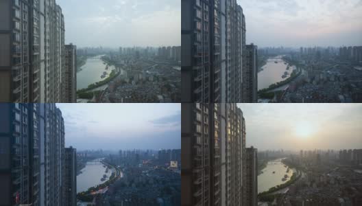 日落在中国湖北武汉汉江上的时间流逝与建筑窗户上的太阳反射高清在线视频素材下载
