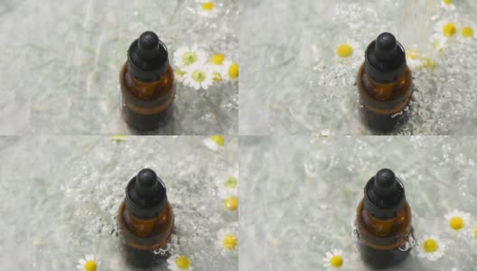 一股水流倒进一个装有分配器的药瓶和甘菊花中高清在线视频素材下载