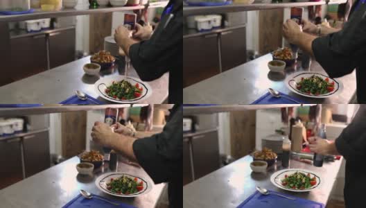 创意厨师，把酱汁倒在沙拉碗的边缘，这样他就可以装饰这顿饭了高清在线视频素材下载