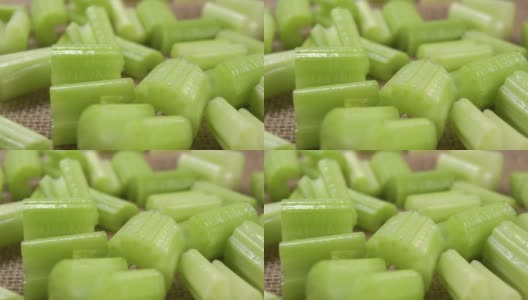 切成片的新鲜芹菜茎放在粗麻布桌布上高清在线视频素材下载