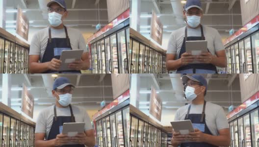 亚洲杂货店经理戴着防护口罩高清在线视频素材下载