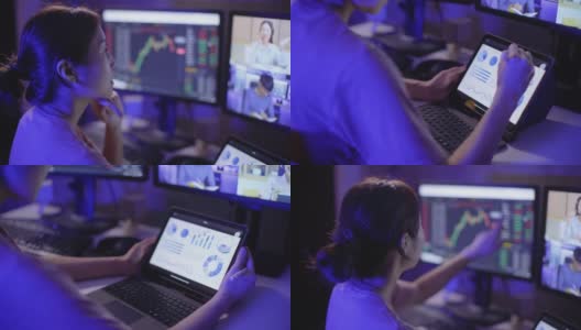 年轻的女企业家拿着数字平板电脑，使用多个电脑屏幕学习投资金融，同时与她的伙伴进行视频电话会议高清在线视频素材下载