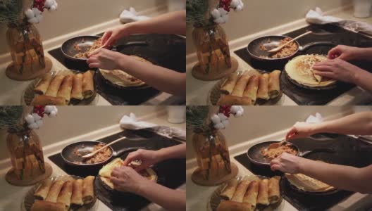 在忏悔节上自制俄罗斯煎饼配肉。一个女人在厨房里做薄饼高清在线视频素材下载