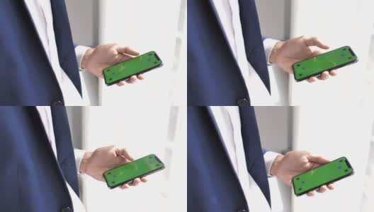 人的手用绿屏手机，iPhone X高清在线视频素材下载
