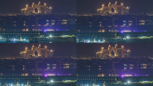 在阿拉伯联合酋长国迪拜，从屋顶上鸟瞰朱美拉棕榈岛的夜景高清在线视频素材下载