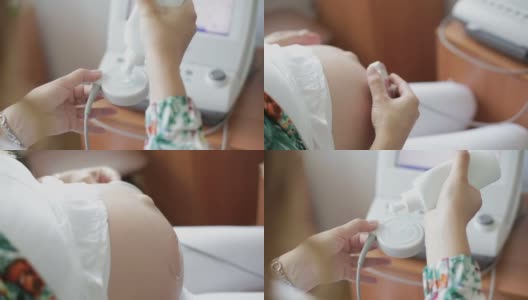 孕妇将这种凝胶贴在传感器上，用来监测肚子里婴儿的心率。高清在线视频素材下载