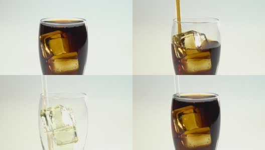 苏打水装在玻璃杯里，冰通过管子喝。白色背景高清在线视频素材下载
