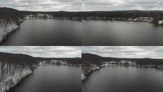 新泽西州伦道夫郊区丘陵湖泊下雪的航拍视频高清在线视频素材下载