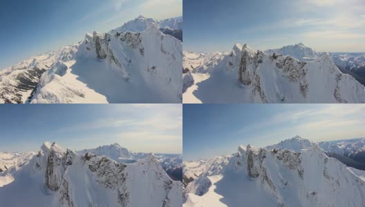 史诗航空镜头飞行近雪覆盖的锯齿山山脊后面的舒克山喀斯喀特山华盛顿州Whatcom县的尖峰高清在线视频素材下载